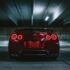 red sports car on concrete flooring