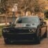 black coupe on concrete road